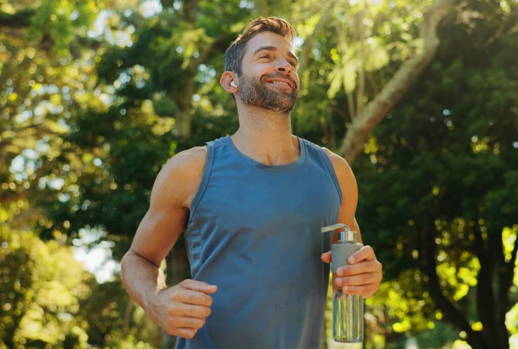 Active adult exercising outdoors to support longevity, health, and overall well-being.