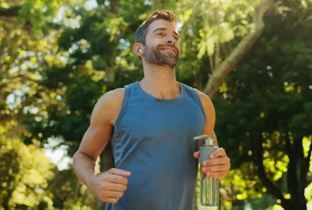 Active adult exercising outdoors to support longevity, health, and overall well-being.